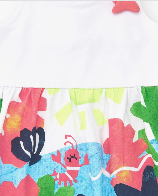 TucTuc Vestido Para Niña En Blanco Con Tirantes Cruzados Y Falda Floral. Colección: Color The Sea