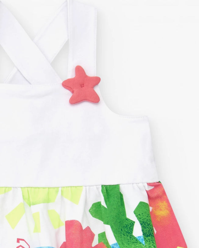 TucTuc Vestido Para Niña En Blanco Con Tirantes Cruzados Y Falda Floral. Colección: Color The Sea