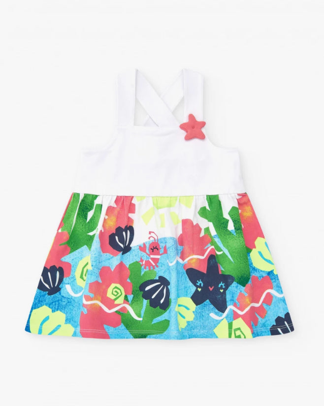 TucTuc Vestido Para Niña En Blanco Con Tirantes Cruzados Y Falda Floral. Colección: Color The Sea