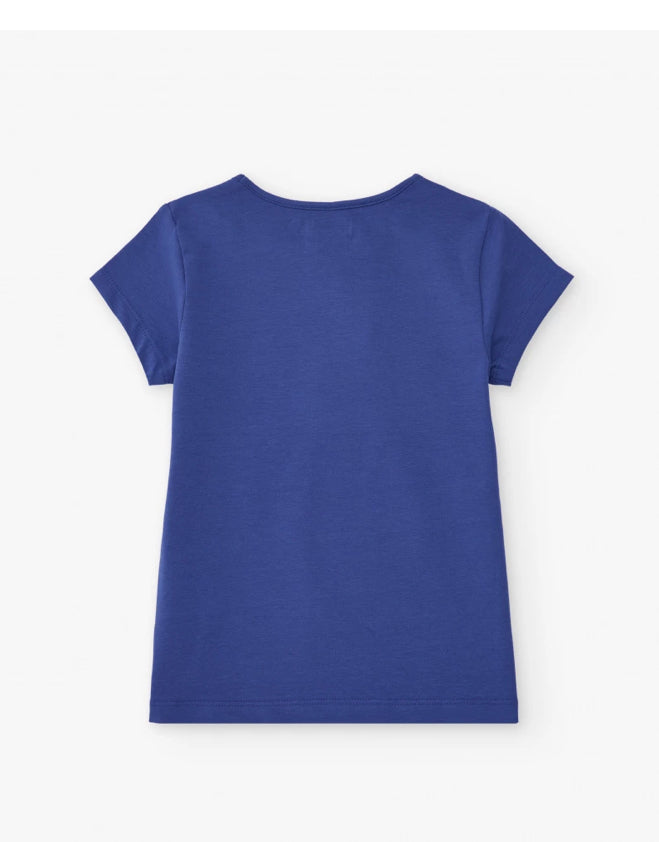 TucTuc NK Beyond The Beach Camiseta niña en azul cobalto con estampado floral lateral Short para niña en blanco con cintura elástica y lazo decorativo