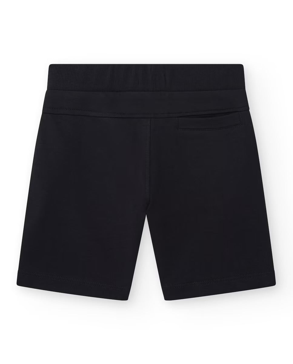 TUC TUC Conjunto Camiseta para niño en negro con estampado tropical Bermuda en negro con bolsillo lateral y cordón de ajuste