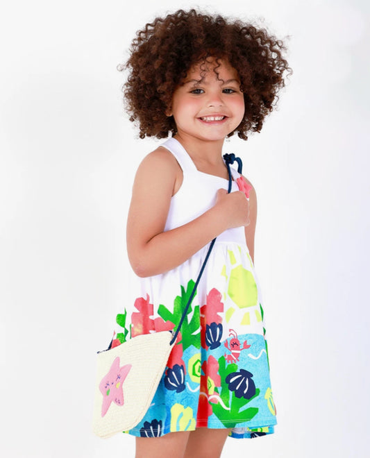 TucTuc Vestido Para Niña En Blanco Con Tirantes Cruzados Y Falda Floral. Colección: Color The Sea