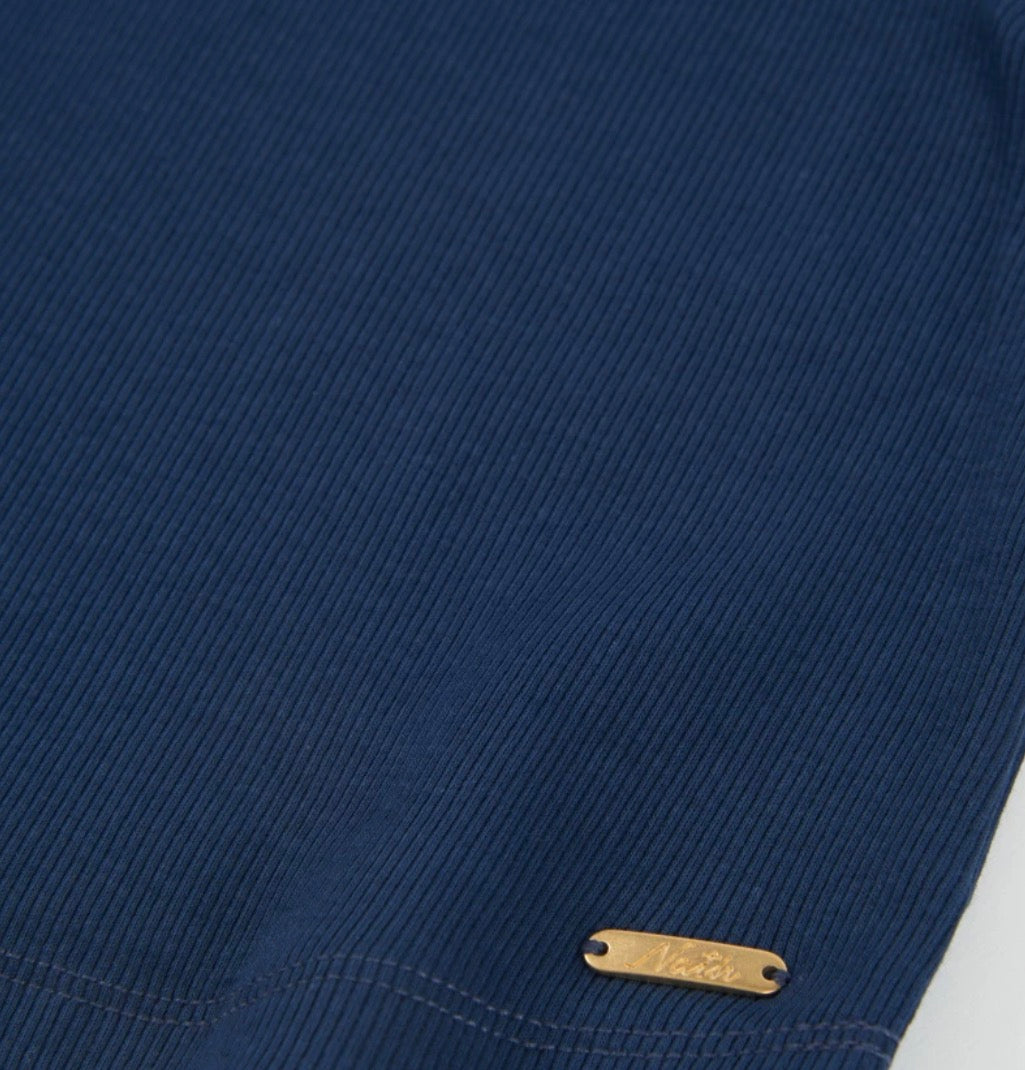 TucTuc NK Top Con Tejido Canelé Y Short Con Pliegues Frontales